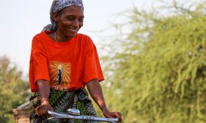 Hilaria Pashcal sells solar lights and clean cookstoves to her community in Tanzania. (Credit: Solar Sisters)