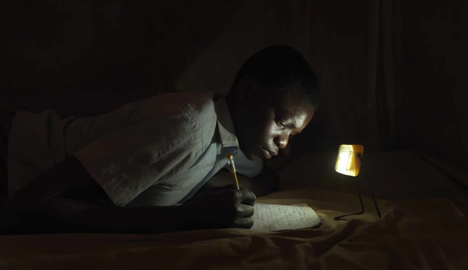 Derrick is able to complete home work after dark due to accessing the rural schools 'light library'