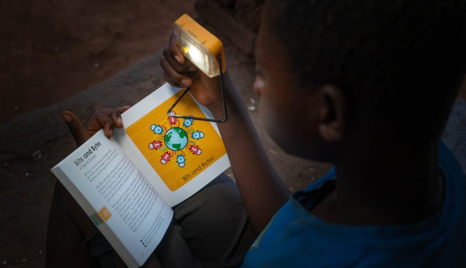 Dalitso reads by the power of his solar light